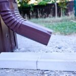 closeup-brown-gutter-pipe-drainage-system-attached-house-guttering-system_653550-763