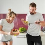 couple-indoors-preparing-meal_23-2148593226