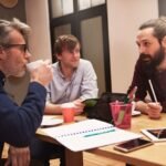 group-creative-people-analyzing-result-work_329181-15495