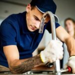 plumber-fixing-kitchen-sink_53876-47594